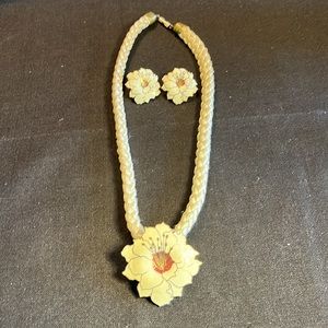 Floral enamel pendant on rope necklace with a pair of white gold tone earrings